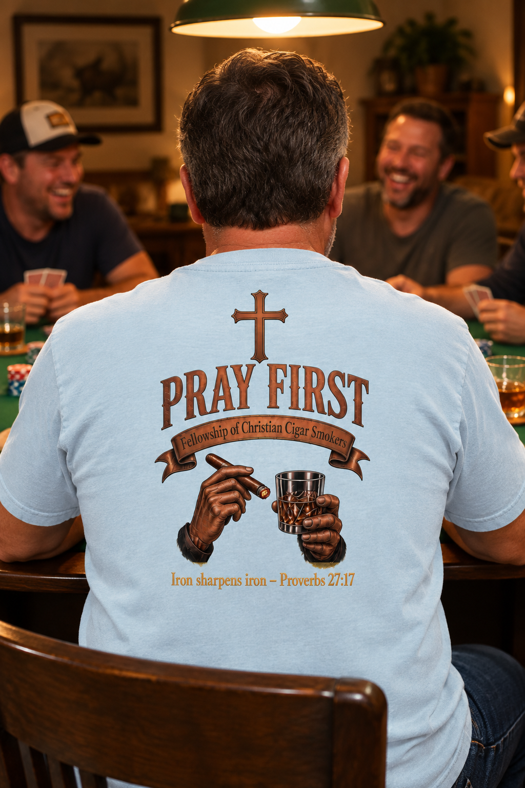 Man in Chambray Iron Sharpens Iron tee at a poker table, back view